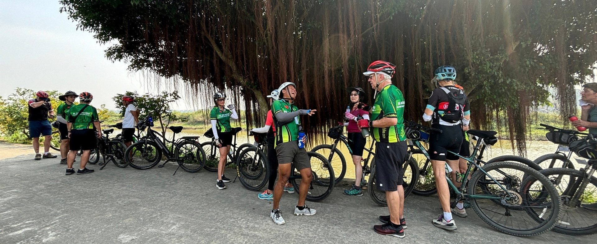 Mr. Kim Linh guiding an international group on a Vietnam bike tour
