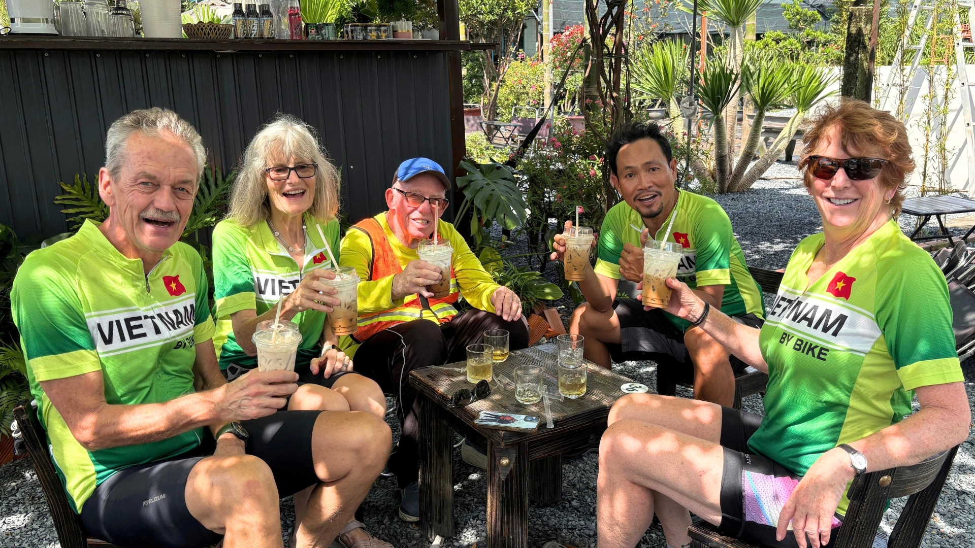Lok Ly guiding a bicycle expedition through rural Vietnam routes